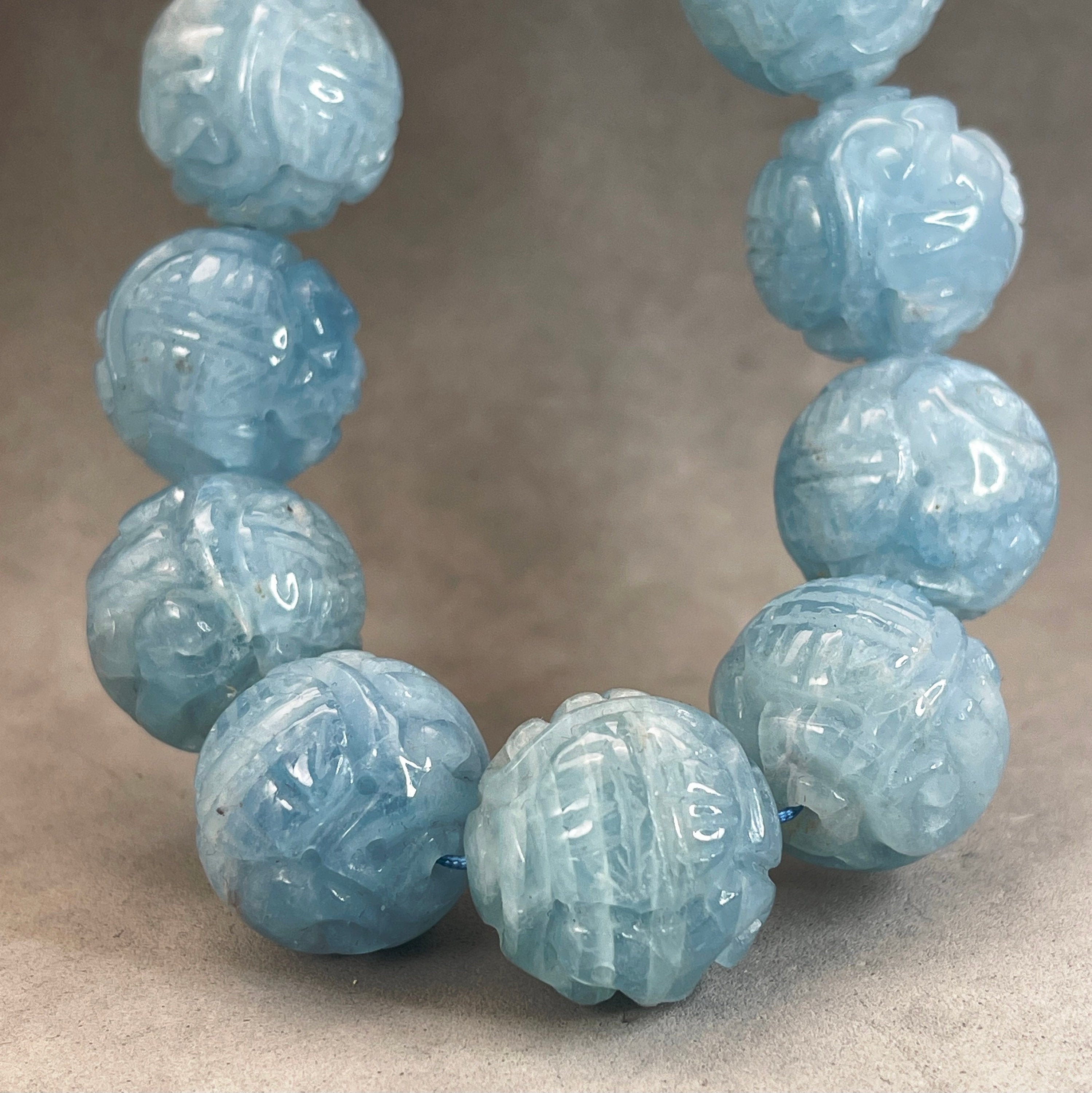 Carved stone best sale beads