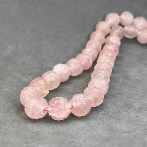 Rose quartz carving: One hand carved rose quartz bead with dragon and longevity symbol, natural color, pink stone bead, year of the dragon