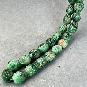 Jade carving: One oval hand carved natural color jadeite bead, carved with dragon and longevity symbols, oval bead, natural color fei cui