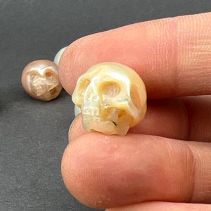 Bead Bar by Artrade: One(1) hand carved yellow fresh water pearl skull, natural luster, not Drilled, very details