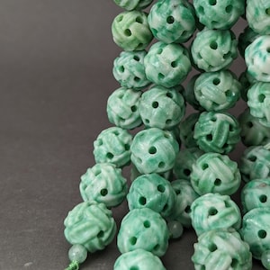 Bead Bar by Artrade: One(1) hand carved Qinghai jade bead with symbol of eternity, natural color, green, eternity knots bead