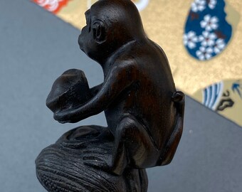 Hand Carved Teakwood Netsuke: Monkey Seated on Bread of Corn