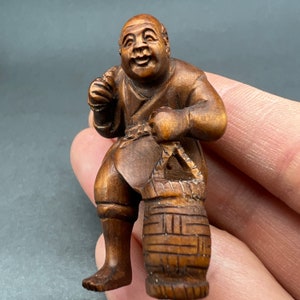 Boxwood carving: Hand carved boxwood Japanese fisherman, or a merchant, with his pet turtle, intricate carving, rare,  signed by artist