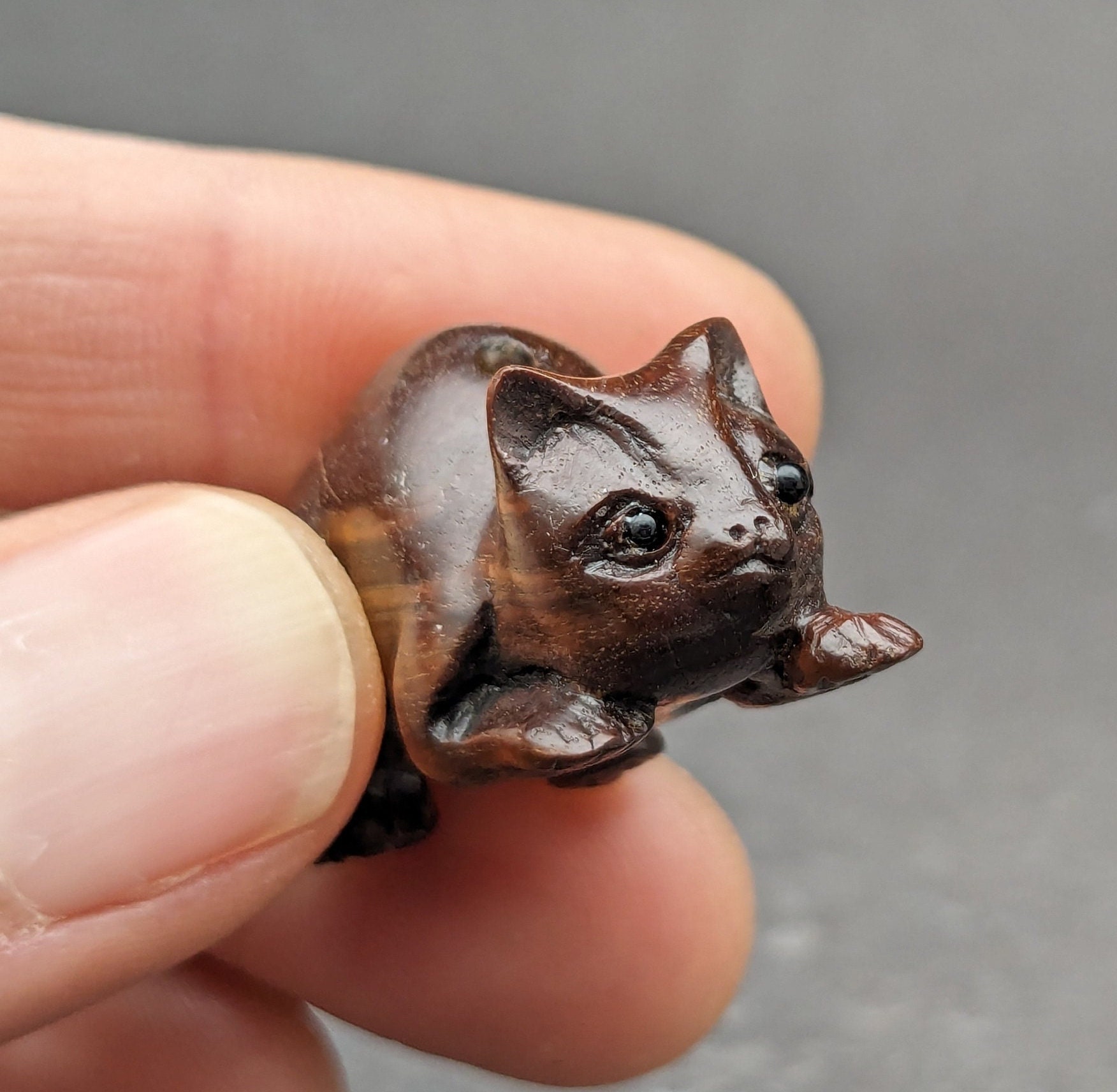 One hand carved teakwood ojime: cat, dark wood cat bead, wood cat bead, fine details, wood cat toggle, hand carved and signed by the carver