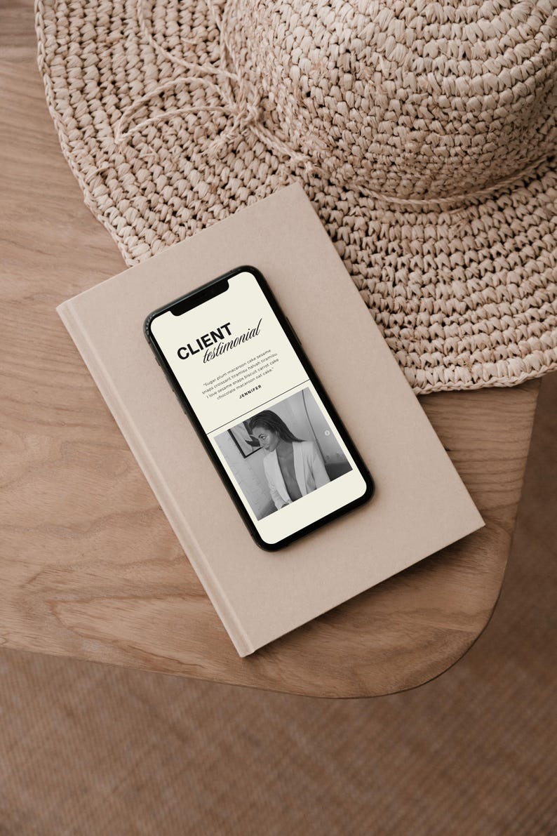 May include: A smartphone displaying a client testimonial page with the text CLIENT testimonial, a short paragraph, and a black and white photograph of a person in a blazer, resting on a beige notebook next to a woven straw hat.