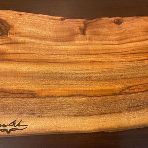 Handcrafted camphor laurel wood cutting boards. Each varies in size and shape.