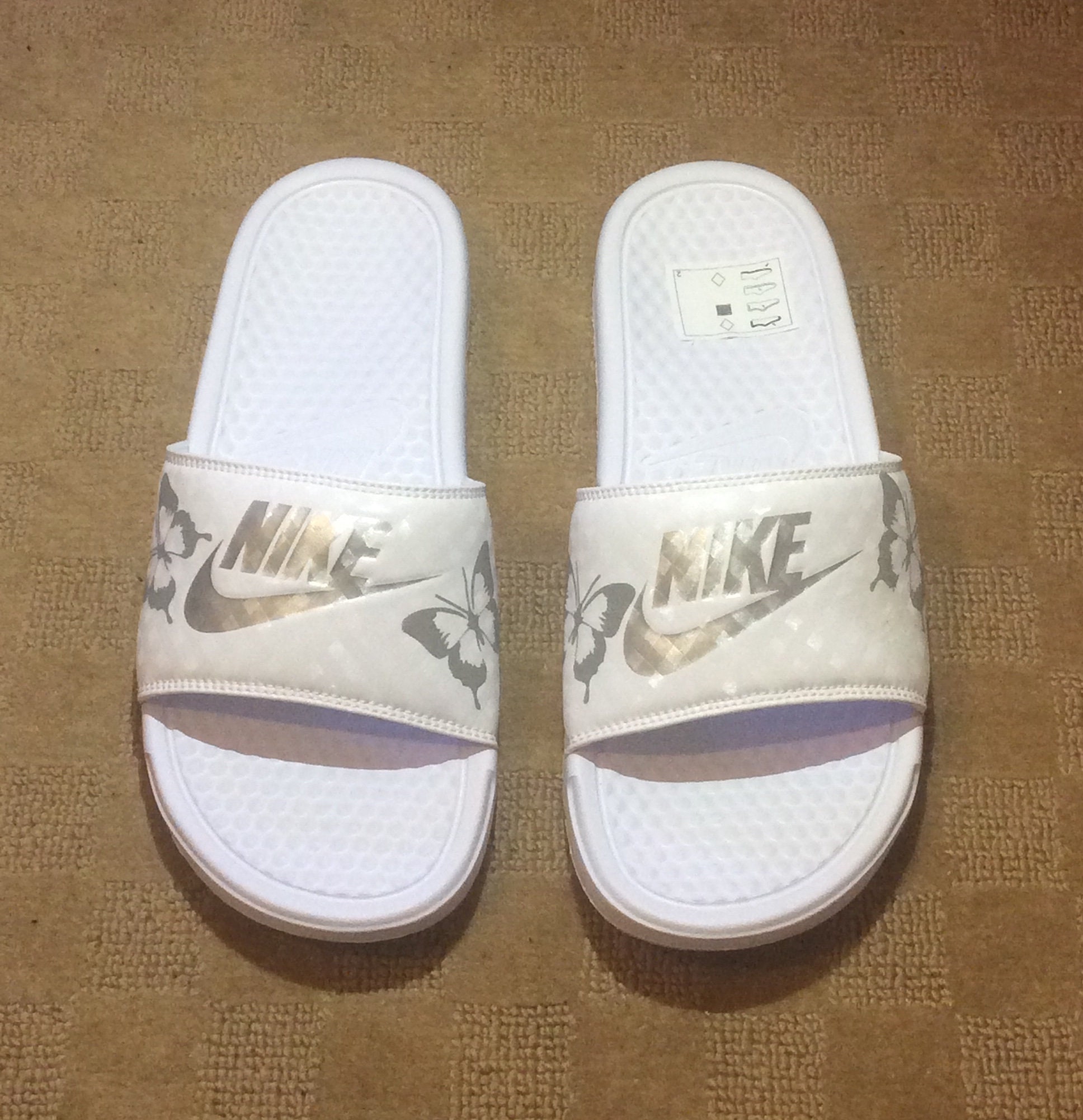 nike slides with butterflies