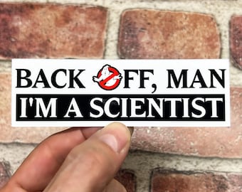 May include: White sticker with black text that reads "Back off, man I'm a scientist". A red circle with a diagonal line through it contains a white ghost figure.