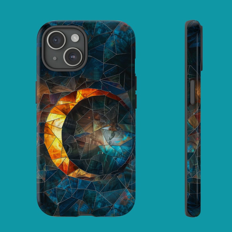 May include: A phone case with a mosaic design featuring a crescent moon shape in shades of blue, orange, and yellow.