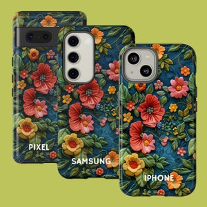 May include: Three phone cases with a floral design. The cases are black with a blue background and feature a variety of flowers in shades of red, pink, yellow, and white. The text "PIXEL", "SAMSUNG", and "IPHONE" is printed on the cases.