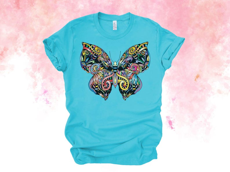 A turquoise t-shirt with a colorful, intricate butterfly design printed on it.