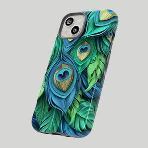 May include: A phone case with a peacock feather design. The case is blue, green, and gold with a detailed pattern of feathers.