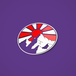 May include: A white circle with a red and white rising sun design and a white mountain range in the foreground.