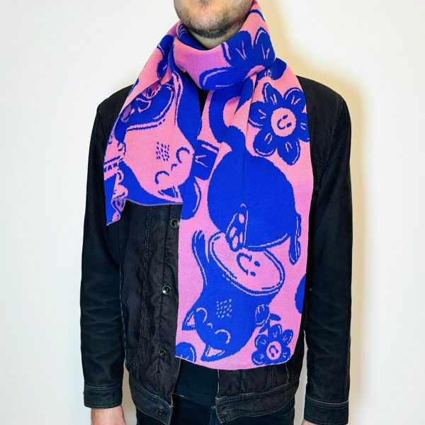 finely knitted scarf with a psychedelic cat motif