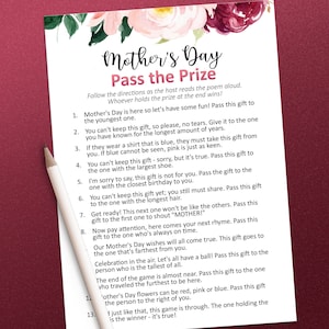May include: A printable Mother's Day game with instructions for a "Pass the Prize" game. The game involves passing a gift around a group of people based on different criteria, such as who is the youngest, who has the longest hair, and who is the tallest.