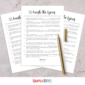 May include: A printable game card with the title "Finish the Lyrics". The card features a list of song lyrics with blanks for players to fill in the missing words. The game is designed to test players' knowledge of popular love songs.