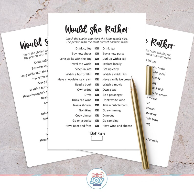 May include: Three white paper sheets with the text "Would she Rather" printed in black. The game asks questions like "Drink coffee OR Drink tea?" A gold pen rests on the papers.