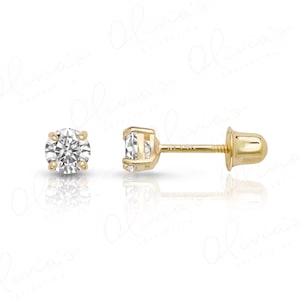 May include: A pair of round-cut clear stud earrings set in 14k yellow gold. One earring is shown from the front, displaying the faceted stone, while the other is shown from the side, revealing the post, the 14k stamp, and the screw-back closure.