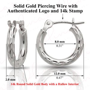 May include: A pair of solid gold hoop earrings with a textured surface. The earrings are 12.0 mm (0.47") in diameter and 8.0 mm (0.31") wide. The text on the image reads "Solid Gold Piercing Wire with Authenticated Logo and 14k Stamp."