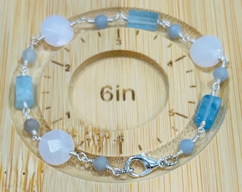 Wire wrap pink and blue gemstone bracelet in silver wire