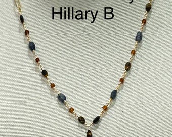 Gold wire wrap and chain horse shoe pendant necklace with gemstones