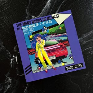 May include: A purple artbook titled "THE MANY WORKS OF MIZUCAT" with Japanese text. The cover features an anime-style illustration of a person in a yellow jumpsuit, a red car, and the text "2020-2025". The artbook is labeled "Artbook No. 2".