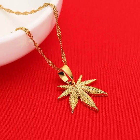 Gold cannabis pendant store