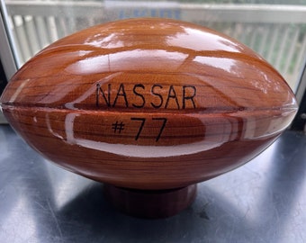 Engraved Lake Forest High School custom solid cedar football,.  With every purchase, we donate 20 dollars to the LFHS Dads Club.