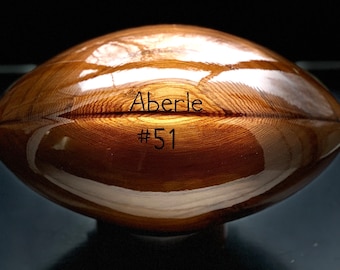 Engraved custom solid cedar wooden football with your favorite team logo.
