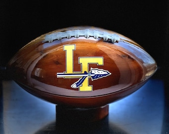 Lake Forest High School  custom solid cedar wooden football.   With every purchase we donate 20 dollars to the LFHS Dads club.