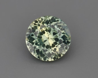 0,96 ct Natuurlijke, onverhitte saffier, geel/blauwgroen, rond, 6,00 x 6,00 mm