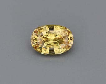 0,97 ct natuurlijke, onverhitte saffier, geel-oranje, ovaal, 6,98 x 4,97 mm