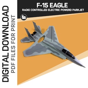 Könnte beinhalten: Ein graues und weißes Tarnmuster F-15 Eagle Modellflugzeug. Das Modell ist ein ferngesteuertes elektrisch betriebenes Parkjet. Der Text "DIGITAL DOWNLOAD PDF FILES FOR PRINT" befindet sich auf der linken Seite des Bildes. Der Text "F-15 EAGLE RADIO CONTROLLED ELECTRIC POWERD PARKJET" befindet sich oben im Bild.