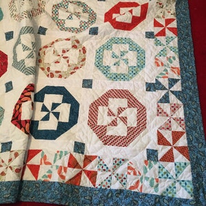 Moda fabric Pinwheel handmade Quilt, queen size, warm colors, cozy quilt.