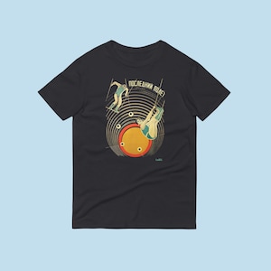 May include: Black t-shirt with a retro graphic of two figures performing a trapeze act. The graphic includes the text "ПОСЛЕДНИЙ ПОДЕ?" in Cyrillic.