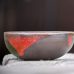 Bowl_flat, black clay glazed red