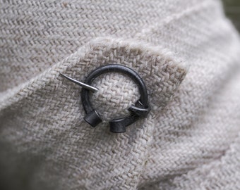 Pair of miniature penannular brooches with cilindrical terminals 9-13th. centutry. Two small brooches for winingas.