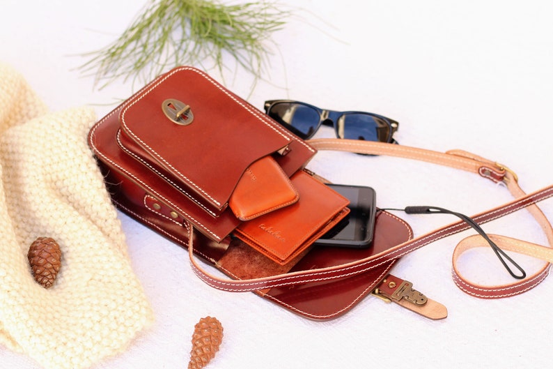 Small cowhide leather handbag with adjustable strap and lock for men or women, Leather crossbody bag for women image 1