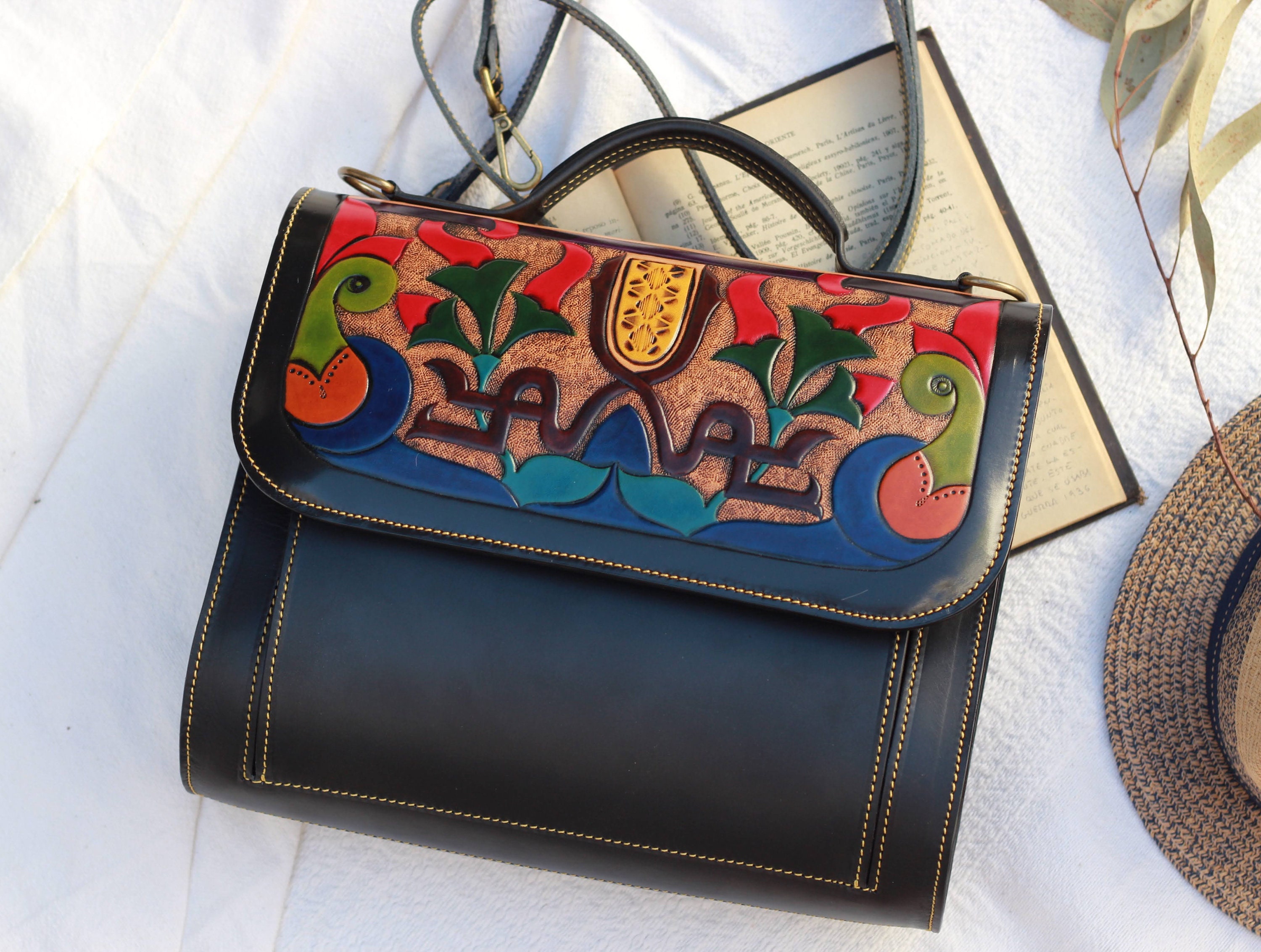 Handcrafted Black Leather Pocketbook with Spanish Alandalus Design, Spacious black leather purse with top handle and detachable strap.