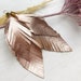 see more listings in the Leather feather earrings section