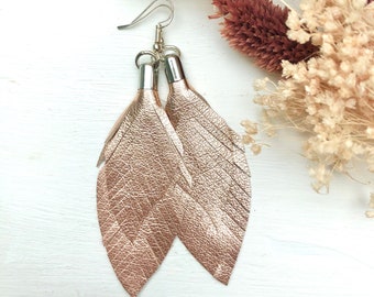 small leather feather earrings in rosé metallic