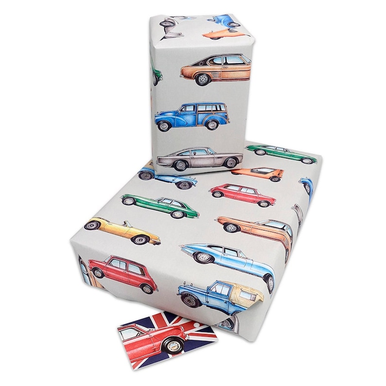 May include: A sheet of wrapping paper with a vintage car design. The paper is white with a variety of colorful cars printed on it. The cars are all different makes and models, and they are all drawn in a cartoon style. The paper is perfect for wrapping gifts for car enthusiasts.
