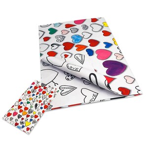 May include: White tissue paper with a colorful heart pattern. The hearts are in various colors, including red, pink, blue, green, and purple. The word "LOVE" is written on some of the hearts.