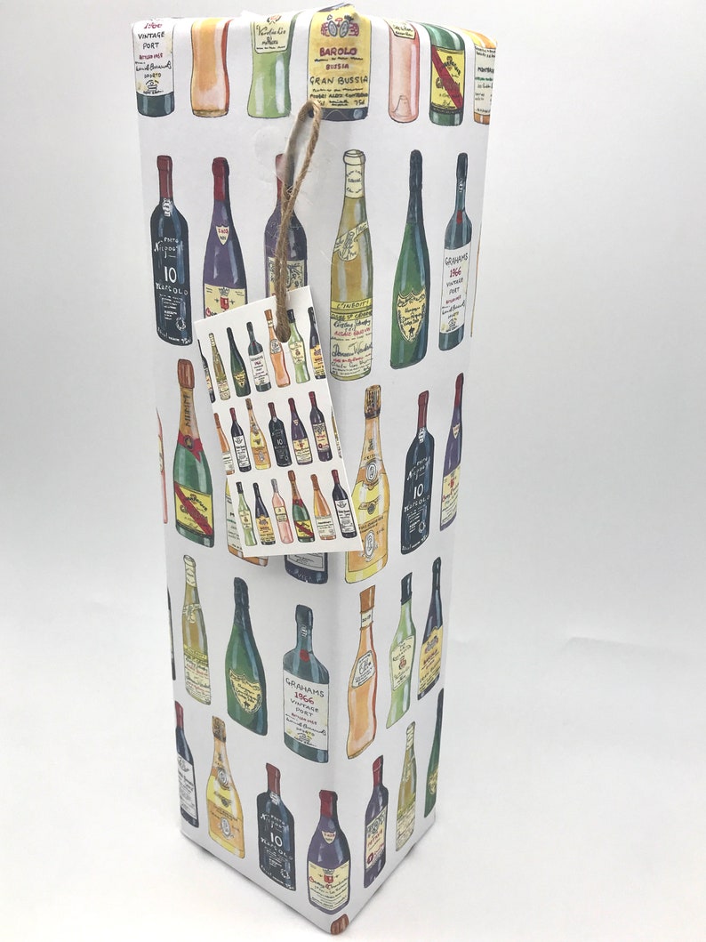 May include: White gift wrap with a repeating pattern of colorful wine bottles. The bottles are drawn in a cartoon style and include labels with text like "Barolo Gran Bussia" and "Graham's 1966 Vintage Port".