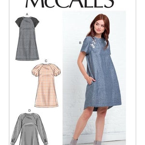 May include: A sewing pattern for a dress with four different styles. The pattern includes a short-sleeved dress with a round neckline, a short-sleeved dress with a round neckline and puff sleeves, a short-sleeved dress with a round neckline and a contrasting yoke, and a long-sleeved dress with a round neckline. The pattern is from McCall's and the pattern number is M7862.