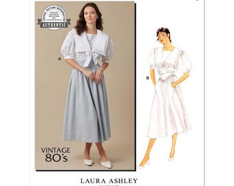 May include: McCall's M8540 sewing pattern envelope featuring a Laura Ashley design. The image displays a dress with a large sailor collar, puff sleeves, and a full skirt. Text includes 'McCall's', 'M8540', 'VINTAGE 80's', and 'LAURA ASHLEY SINCE 1953'.