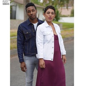 May include: A couple wearing denim jackets. The woman is wearing a white denim jacket over a burgundy dress. The man is wearing a dark blue denim jacket over a grey t-shirt and grey jeans. Simplicity Pattern S8845.