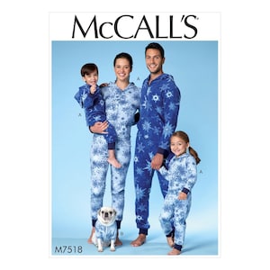 May include: McCall's pattern for family matching snowflake pajamas. The image shows a family of four and a dog wearing matching blue and white snowflake print hooded onesie pajamas. The pattern number is M7518.