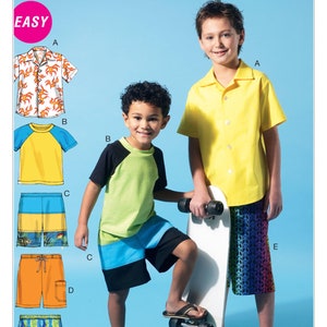 May include: A McCall's pattern for boys' clothing, labeled "EASY". The pattern includes five different designs: a short-sleeved shirt with a tropical print, a short-sleeved t-shirt with a yellow and blue color block, a pair of shorts with a colorful fish print, a pair of orange shorts with a pocket, and a pair of blue shorts with a wavy pattern.