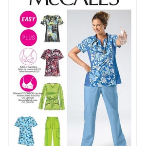 May include: A sewing pattern for scrubs with different styles and sizes. The pattern includes a top with a V-neck and short sleeves, and pants with pockets. The pattern is available in sizes for women with A/B, C, D, and C/DDDDDD cup sizes. The pattern is labeled "Easy" and "Plus".